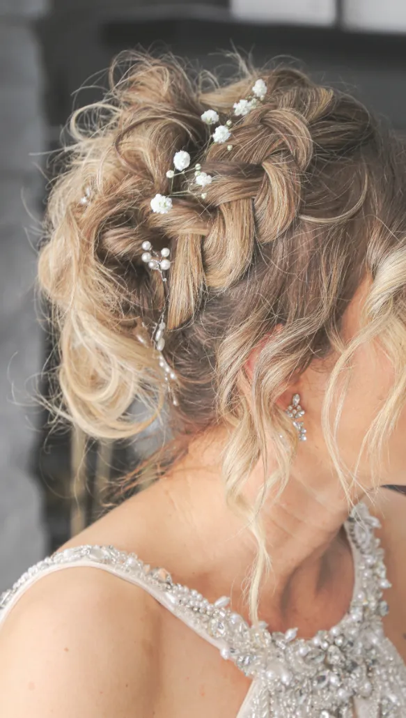 bride wearing dress and earrings