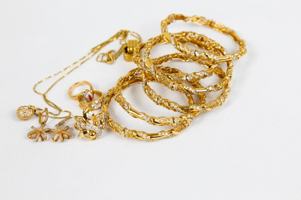 Multiple gold bangles stacked on each other