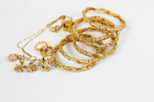 Multiple gold bangles stacked on each other