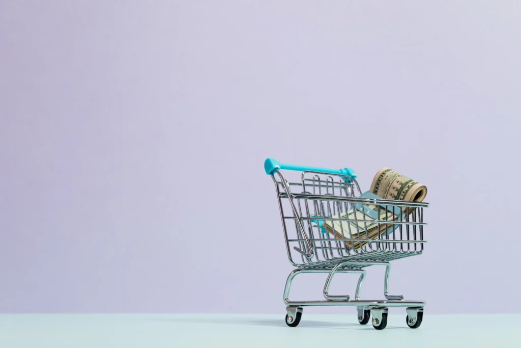 image of a shopping trolley with cash in it