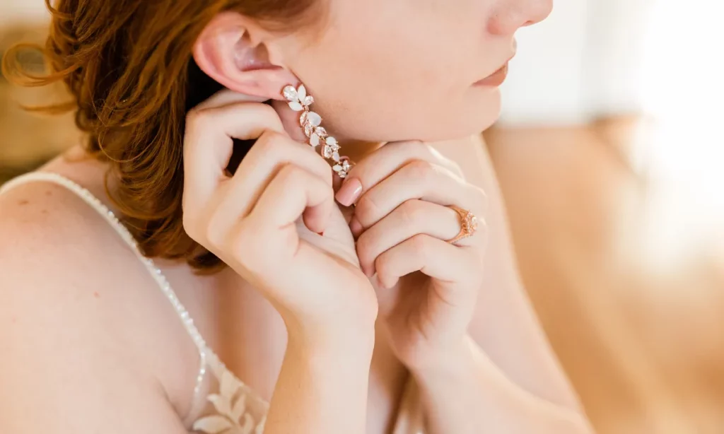 girl wearing earrings with gemstones